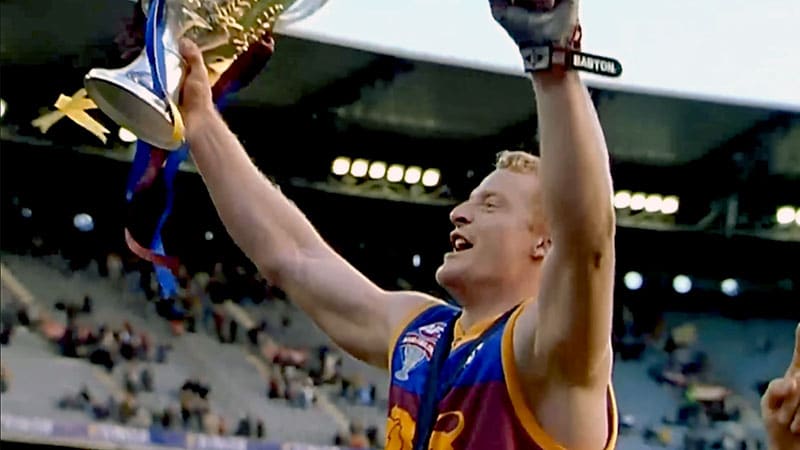 Michael Voss holds up the premiership cup for the Brisbane Lions